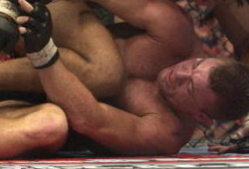 LONDON - JULY 13:  Carlos Newton of Canada battles with Matt Hughes of the USA during the Ultimate Fighting Championship, 'Brawl in the Royal Albert Hall', in the Royal Albert Hall London, England on July 13, 2002. (Photo by John Gichigi/Getty Images)