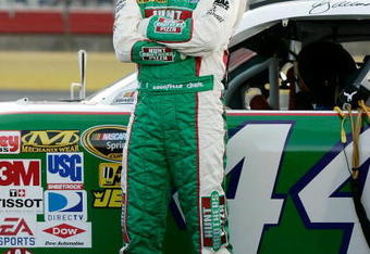 CONCORD, NC - MAY 21:  AJ Allmendinger, driver of the #44 Hunt Brothers Pizza Dodge, stands on the grid during qualifying for the NASCAR Sprint Cup Series Coca-Cola 600 on May 21, 2009 at Lowe's Motor Speedway in Concord, North Carolina.  (Photo by Jason Smith/Getty Images)