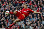 LIVERPOOL, UNITED KINGDOM - OCTOBER 18: Liverpool striker Dirk Kuyt scores the third Liverpool goal during the Barclays Premier League match between Liverpool and Wigan Athletic at Anfield on October 18, 2008 in Liverpool, England.  (Photo by Stu Forster/Getty Images)
