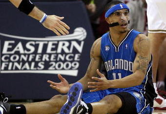 CLEVELAND - MAY 22: Courtney Lee #11 of the Orlando Magic reacts after an offensive foul is called on him against the Cleveland Cavaliers in Game Two of the Eastern Conference Finals during the 2009 Playoffs at Quicken Loans Arena on May 22, 2009 in Cleveland, Ohio. NOTE TO USER: User expressly acknowledges and agrees that, by downloading and or using this photograph, User is consenting to the terms and conditions of the Getty Images License Agreement  (Photo by Elsa/Getty Images)