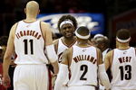 CLEVELAND - MAY 20:  LeBron James #23 reacts after a play with teammates Zydrunas Ilgauskas #11, Mo Williams #2 and Delonte West #13 of the Cleveland Cavaliers against the Orlando Magic in Game One of the Eastern Conference Finals during the 2009 Playoffs at Quicken Loans Arena on May 20, 2009 in Cleveland, Ohio. NOTE TO USER: User expressly acknowledges and agrees that, by downloading and or using this photograph, User is consenting to the terms and conditions of the Getty Images License Agreement  (Photo by Elsa/Getty Images)