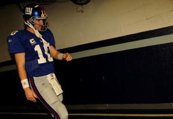 IRVING, TX - DECEMBER 14:  Quarterback Eli Manning #10 of the New York Giants walks down the tunnel to the field before a game against the Dallas Cowboys at Texas Stadium on December 14, 2008 in Irving, Texas.  (Photo by Ronald Martinez/Getty Images)