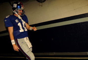 IRVING, TX - DECEMBER 14:  Quarterback Eli Manning #10 of the New York Giants walks down the tunnel to the field before a game against the Dallas Cowboys at Texas Stadium on December 14, 2008 in Irving, Texas.  (Photo by Ronald Martinez/Getty Images)
