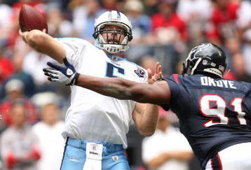 HOUSTON - DECEMBER 14:  Quarterback Kerry Collins #5 of the Tennessee Titans throws a pass over defensive tackle Amobi Okoye #91 of the Houston Texans on December 14, 2008 at Reliant Stadium in Houston, Texas.  (Photo by Stephen Dunn/Getty Images)