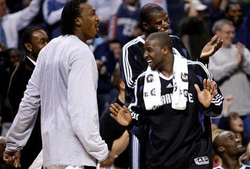 CHARLOTTE, NC - MARCH 16:  Teammates Gerald Wallace #3 and Raymond Felton #20 of the Charlotte Bobcats celebrate on the bench during a 112-86 victory over the Toronto Raptors at Time Warner Cable Arena on March 16, 2009 in Charlotte, North Carolina.  NOTE TO USER: User expressly acknowledges and agrees that, by downloading and/or using this Photograph, user is consenting to the terms and conditions of the Getty Images License Agreement.  (Photo by Streeter Lecka/Getty Images)