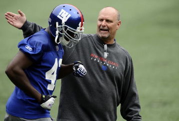 EAST RUTHERFORD, NJ - MAY 09:  Linebacker coach Jim Herrmann and Kenny Ingram #43 of the New York Giants work out at rookie camp on May 9, 2009 in East Rutherford, New Jersey.  (Photo by Jeff Zelevansky/Getty Images)