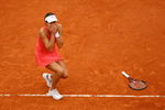 PARIS - JUNE 07:  Ana Ivanovic of Serbia reacts as she clinches victory during the Women's Singles Final match against Dinara Safina of Russia on day fourteen of the French Open at Roland Garros on June 7, 2008 in Paris, France.  (Photo by Julian Finney/Getty Images)