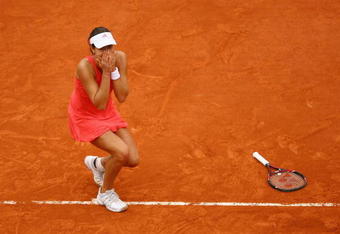 PARIS - JUNE 07:  Ana Ivanovic of Serbia reacts as she clinches victory during the Women's Singles Final match against Dinara Safina of Russia on day fourteen of the French Open at Roland Garros on June 7, 2008 in Paris, France.  (Photo by Julian Finney/Getty Images)