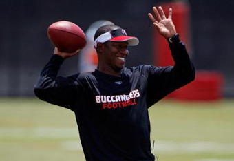 TAMPA - MAY 01:  Head coach Raheem Morris of the Tampa Bay Buccaneers warms up during the Buccaneers Rookie Minicamp at One Buccaneer Place on May 1, 2009 in Tampa, Florida.  (Photo by J. Meric/Getty Images)