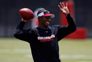 TAMPA - MAY 01:  Head coach Raheem Morris of the Tampa Bay Buccaneers warms up during the Buccaneers Rookie Minicamp at One Buccaneer Place on May 1, 2009 in Tampa, Florida.  (Photo by J. Meric/Getty Images)