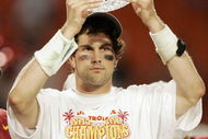 MIAMI - JANUARY 4:  Quarterback Matt Leinart #11 of the USC Trojans holds up the championship trophy after defeating the Oklahoma Sooners 55-19 to win the FedEx Orange Bowl 2005 National Championship on January 4, 2005 at Pro Player Stadium in Miami, Florida.  (Photo by Brian Bahr/Getty Images)