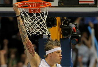 DENVER - MAY 23:  Chris Andersen #11 of the Denver Nuggets hangs on the rim after he dunks the ball in the first quarter against the Los Angeles Lakers in Game Three of the Western Conference Finals during the 2009 NBA Playoffs at Staples Center on May 23, 2009 in Denver, Colorado. NOTE TO USER: User expressly acknowledges and agrees that, by downloading and or using this photograph, User is consenting to the terms and conditions of the Getty Images License Agreement.  (Photo by Doug Pensinger/Getty Images)