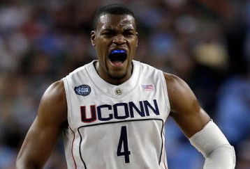 DETROIT - APRIL 04:  Jeff Adrien #4 of the Connecticut Huskies reacts in the first half while taking on the Michigan State Spartans during the National Semifinal game of the NCAA Division I Men's Basketball Championship at Ford Field on April 4, 2009 in Detroit, Michigan.  (Photo by Andy Lyons/Getty Images)