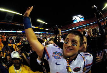 MIAMI - JANUARY 08:  Tim Tebow #15 of the Florida Gators celebrates as he walks off the field after their 24-14 against the Oklahoma Sooners during the FedEx BCS National Championship game at Dolphin Stadium on January 8, 2009 in Miami, Florida.  (Photo by Marc Serota/Getty Images)