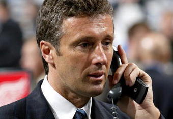 COLUMBUS, OH - JUNE 23:  General manager Doug Wilson of the San Jose Sharks talks on the telephone during the 2007 NHL Entry Draft at Nationwide Arena on June 23, 2007 in Columbus, Ohio.  (Photo by Dave Sandford/Getty Images)