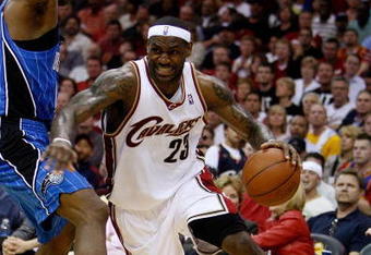 CLEVELAND - MAY 22:  LeBron James #23 of the Cleveland Cavaliers handles the ball against the Orlando Magic in Game Two of the Eastern Conference Finals during the 2009 Playoffs at Quicken Loans Arena on May 22, 2009 in Cleveland, Ohio. NOTE TO USER: User expressly acknowledges and agrees that, by downloading and or using this photograph, User is consenting to the terms and conditions of the Getty Images License Agreement  (Photo by Gregory Shamus/Getty Images)
