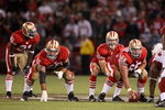 SAN FRANCISCO - SEPTEMBER 10:  Frank Gore #21, Justin Smiley #65 and Eric Heitmann #66 wait for Alex Smith #11 of the San Francisco 49ers to receive the ball during an NFL game against the Arizona Cardinals on September 10, 2007 at Monster Park in San Francisco, California.  The 49ers won 20-17.  (Photo by Jed Jacobsohn/Getty Images)