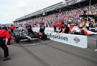 INDIANAPOLIS - MAY 22:  Marco Andretti (left) driver of the #26 Andretti Green Racing Dallara Honda competes with Helio Castroneves driver of the #3 Team Penske Dallara Honda during the final round of the pit stop challenge during Miller Lite Carb Day for the 93rd running of the Indianapolis 500 at the Indianapolis Motor Speedway on May 22, 2009 in Indianapolis, Indiana.  (Photo by Robert Laberge/Getty Images)