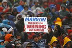 FOXBORO, MA - DECEMBER 16:  Fans  of the New England Patriots display a sign in the direction of  coach Eric Mangini of the New York Jets at Gillette Stadium on December 16, 2007 in Foxboro, Massachusetts. The Patriots won 20-10. (Photo by Jim Rogash/Getty Images)