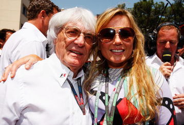 MONTE CARLO, MONACO - MAY 24:  F1 supremo Bernie Ecclestone and Geri Halliwell of the Spice Girls meet on the grid before the Monaco Formula One Grand Prix at the Monte Carlo Circuit on May 24, 2009 in Monte Carlo, Monaco.  (Photo by Mark Thompson/Getty Images)