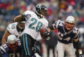 FOXBORO, MA - DECEMBER 14:  Fred Taylor #28 of the Jacksonville Jaguars runs in front of Bobby Hamilton #91 and Tedy Bruschi #54 of the New England Patriots on December 14, 2003 at Gillette Stadium in Foxboro, Massachusetts. The Patriots won 27-13.  (Photo by Rick Stewart/Getty Images)
