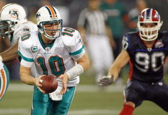 TORONTO, ON - DECEMBER 07:  Quarterback Chad Pennington #10 of the Miami Dolphins looks to hand off the ball during the game against the Buffalo Bills on December 7, 2008 at Rogers Centre in Toronto, Ontario, Canada. The Dolphins won 16-3. (Photo by Rick Stewart/Getty Images)