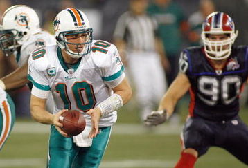 TORONTO, ON - DECEMBER 07:  Quarterback Chad Pennington #10 of the Miami Dolphins looks to hand off the ball during the game against the Buffalo Bills on December 7, 2008 at Rogers Centre in Toronto, Ontario, Canada. The Dolphins won 16-3. (Photo by Rick Stewart/Getty Images)