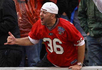 ATHENS, GA - NOVEMBER 29:  A Georgia Bulldogs fan yells during a defensive stand during the game between the Georgia Tech Yellow Jackets and the Georgia Bulldogs at Sanford Stadium on November 29, 2008 in Athens, Georgia.  The Yellow Jackets beat Bulldogs 45-42.  (Photo by Mike Zarrilli/Getty Images)