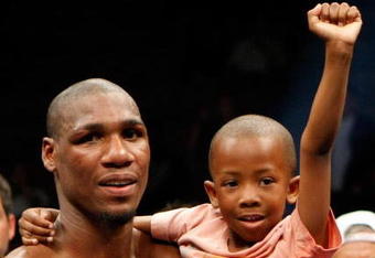 LAS VEGAS - APRIL 11:  Paul Williams holds his son Paul Williams Jr. as he celebrates defeating Winky Wright in a unanimous decision in their middleweight bout at the Mandalay Bay Events Center April 11, 2009 in Las Vegas, Nevada.  (Photo by Ethan Miller/Getty Images)