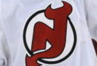 RALEIGH, NC - APRIL 26: Jamie Langenbrunner #15 of the the New Jersey Devils skates as he waits for a face-off in the first period of Game Six of the Eastern Conference Quarterfinals of the 2009 Stanley Cup Playoffs against the Carolina Hurricanes on April 26, 2009 at the RBC Center in Raleigh, North Carolina. (Photo by Steve Dykes/Getty Images)