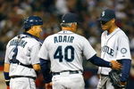 MINNEAPOLIS, MN - APRIL 6: Pitching coach Mike Adair #40 of the Seattle Mariners talks with Felix Hernandez #34 and Kenji Johjima #2 of the Seattle Mariners during a game against the Minnesota Twins at the Metrodome on April 6, 2009 in Minneapolis, Minnesota. (Photo by Scott A. Schneider/Getty Images)