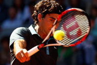 MADRID, SPAIN - MAY 17: Roger Federer of Switzerland plays a backhand against Rafael Nadal of Spain during the Madrid Open Men's Final at the Caja Magica on May 17, 2009 in Madrid, Spain. (Photo by Clive Brunskill/Getty Images)