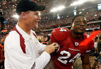 GLENDALE, AZ - JANUARY 18:  (L-R) Head coach Ken Whisenhunt of the Arizona Cardinals celebrates with safety Adrian Wilson #24 after winning the NFC championship game against the Philadelphia Eagles on January 18, 2009 at University of Phoenix Stadium in Glendale, Arizona. The Cardinals defeated the Eagles 32-25 to advance to the Super Bowl.  (Photo by Jamie Squire/Getty Images)