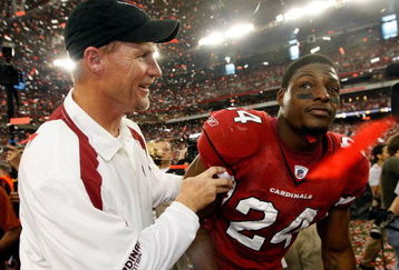 GLENDALE, AZ - JANUARY 18:  (L-R) Head coach Ken Whisenhunt of the Arizona Cardinals celebrates with safety Adrian Wilson #24 after winning the NFC championship game against the Philadelphia Eagles on January 18, 2009 at University of Phoenix Stadium in Glendale, Arizona. The Cardinals defeated the Eagles 32-25 to advance to the Super Bowl.  (Photo by Jamie Squire/Getty Images)