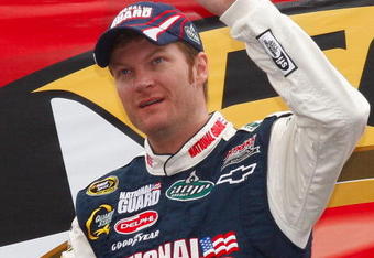 CONCORD, NC - MAY 24: Dale Earnhardt Jr., driver of the #88 National Guard/AMP Energy Chevrolet, waves to the crowd during driver introductions prior to the NASCAR Sprint Cup Series Coca-Cola 600 on May 24, 2009 at Lowe's Motor Speedway in Concord, North Carolina.  (Photo by Geoff Burke/Getty Images for NASCAR)