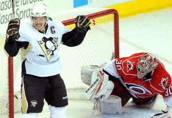 RALEIGH, NC - MAY 23:  Sidney Crosby #87 of the Pittsburgh Penguins reacts after scoring a goal against goaltender Cam Ward #30 of the Carolina Hurricanes during Game Three of the Eastern Conference Championship Round of the 2009 Stanley Cup Playoffs at RBC Center on May 23, 2009 in Raleigh, North Carolina.  (Photo by Grant Halverson/Getty Images)