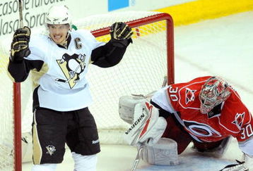 RALEIGH, NC - MAY 23:  Sidney Crosby #87 of the Pittsburgh Penguins reacts after scoring a goal against goaltender Cam Ward #30 of the Carolina Hurricanes during Game Three of the Eastern Conference Championship Round of the 2009 Stanley Cup Playoffs at RBC Center on May 23, 2009 in Raleigh, North Carolina.  (Photo by Grant Halverson/Getty Images)