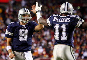 LANDOVER, MD - NOVEMBER 16:  Tony Romo #9 of the Dallas Cowboys celebrates his teams first touchdown against the Washington Redskins with teammate Roy Williams #11 on November 16, 2008 at FedEx Field in Landover, Maryland.  (Photo by Jim McIsaac/Getty Images)