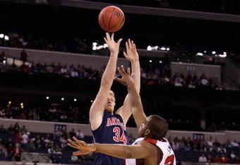 INDIANAPOLIS - MARCH 27:  Chase Budinger #34 of the Arizona Wildcats attempts a shot against Samardo Samuels #24 of the Louisville Cardinals during the third round of the NCAA Division I Men's Basketball Tournament at the Lucas Oil Stadium on March 27, 2009 in Indianapolis, Indiana.  (Photo by Andy Lyons/Getty Images)