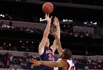 INDIANAPOLIS - MARCH 27:  Chase Budinger #34 of the Arizona Wildcats attempts a shot against Samardo Samuels #24 of the Louisville Cardinals during the third round of the NCAA Division I Men's Basketball Tournament at the Lucas Oil Stadium on March 27, 2009 in Indianapolis, Indiana.  (Photo by Andy Lyons/Getty Images)