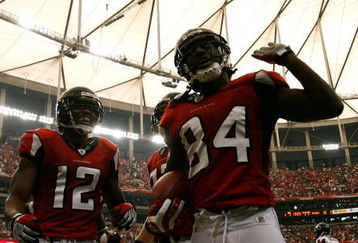 ATLANTA - OCTOBER 12:  Receiver Michael Jenkins #12 celebrates with Roddy White #84 of the Atlanta Falcons after White's touchdown against the Chicago Bears during the game at the Georgia Dome on October 12, 2008 in Atlanta, Georgia.  (Photo by Kevin C. Cox/Getty Images)