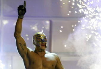 LAS VEGAS - DECEMBER 2:  (U.S. TABLOIDS OUT)   WWE wrestler Rey Mysterio walks on stage during the '1st Annual Video Game Awards' at the MGM Grand Garden Arena December 2, 2003 in Las Vegas, Nevada.  The show premieres on Spike T.V. Thursday, December 4 at 9:00PM ET/PT.  (Photo by Frank Micelotta/Getty Images)