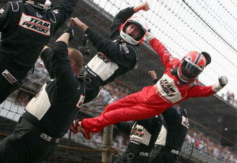 INDIANAPOLIS - MAY 24: Helio Castroneves, driver of the #3 Team Penske Dallara Honda, celebrates his victory with his pit crew and team during the IRL IndyCar Series 93rd running of the Indianapolis 500 on May 24, 2009 at the Indianapolis Motor Speedway in Indianapolis, Indiana. (Donald Miralle/Getty Images )