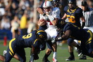 BERKELEY, CA - NOVEMBER 22: Tavita Pritchard #14 of the Stanford Cardinal is sacked by Eddie Young #9 of the California Golden Bears during an NCAA football game on November 22, 2008 at Memorial Stadium in Berkeley, California.  (Photo by Jed Jacobsohn/Getty Images)