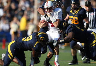 BERKELEY, CA - NOVEMBER 22: Tavita Pritchard #14 of the Stanford Cardinal is sacked by Eddie Young #9 of the California Golden Bears during an NCAA football game on November 22, 2008 at Memorial Stadium in Berkeley, California.  (Photo by Jed Jacobsohn/Getty Images)