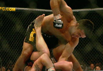 MANCHESTER, UNITED KINGDOM - APRIL 21: Lyoto Machida of Brazil and David Heath of England in action during a Welterweight bout of the Ultimate Fighting Championship at the Manchester Evening News Arena on April 21, 2007 in Manchester, England. (Photo by Gary M. Prior/Getty Images).