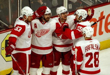 CHICAGO - MAY 24:  (L-R) Johan Franzen #93, Henrik Zetterberg #40, Jiri Hudler #26, Niklas Kronwall #55 and Brian Rafalski #28 of the Detroit Red Wings celebrate after Zetterberg scored a goal in the second period against the Chicago Blackhawks during Game Four of the Western Conference Championship Round of the 2009 Stanley Cup Playoffs on May 24, 2009 at the United Center in Chicago, Illinois.  (Photo by Jim Prisching/Getty Images)
