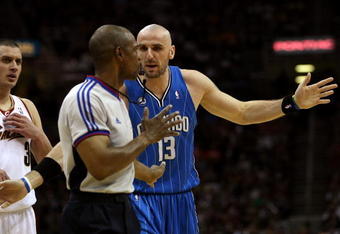 CLEVELAND - MAY 22: Marcin Gortat #13 of the Orlando Magic discusses a call with a referee against  the Cleveland Cavaliers in Game Two of the Eastern Conference Finals during the 2009 Playoffs at Quicken Loans Arena on May 22, 2009 in Cleveland, Ohio. NOTE TO USER: User expressly acknowledges and agrees that, by downloading and or using this photograph, User is consenting to the terms and conditions of the Getty Images License Agreement  (Photo by Elsa/Getty Images)