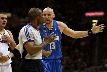 CLEVELAND - MAY 22: Marcin Gortat #13 of the Orlando Magic discusses a call with a referee against  the Cleveland Cavaliers in Game Two of the Eastern Conference Finals during the 2009 Playoffs at Quicken Loans Arena on May 22, 2009 in Cleveland, Ohio. NOTE TO USER: User expressly acknowledges and agrees that, by downloading and or using this photograph, User is consenting to the terms and conditions of the Getty Images License Agreement  (Photo by Elsa/Getty Images)