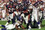 31 Oct 1999: Olandis Gary #22 of the Denver Broncos carries the ball as he is tackled during a game against the Minnesota Vikings at the Mile High Stadium in Denver, Colorado. The Vikings defeated the Broncos 23-20. Mandatory Credit: Rodolfo Ganzales  /Allsport